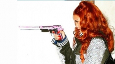 Rihanna Poses With Spunky Pink Gun