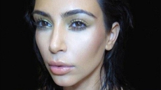 Kim Kardashian Flaunts Cleavage For 'Selfish'