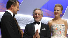 DiCaprio accepts award with bushy beard, neat bun