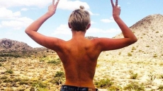 Miley Cyrus Goes Topless For Campaign