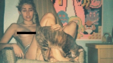 Miley Cyrus Poses Topless With Pet Cat