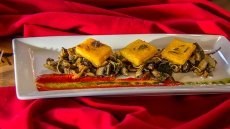 PAN SEARED POLENTA OVER WILD MUSHROOM RAGU & RED PEPPER SAUCE