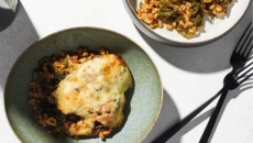 Two cheese baked farro with kale and tomatoes
