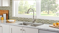 REACT touch-free kitchen faucet stays clean even when you’re not