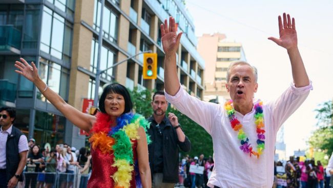 Revellers drench Mark Carney with water as Toronto celebrates Pride Parade