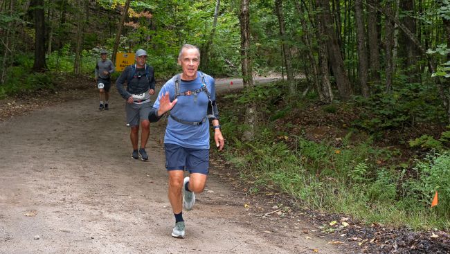 Carney surprises many with appearance at long-distance trail race