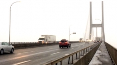 Helicopter To Prevent Snow, Ice Bombs Falling On Vehicles From Alex Fraser Bridge Cables