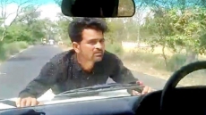 WATCH: UP Government Official Drives For 4 KM As Man Clings On To Bonnet