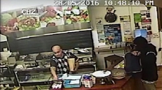 Watch: Shop Owner Keeps Robber Waiting As He Attends To Customer