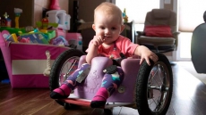 'Nothing Can Stop Her:' Paralyzed Edmonton Tot A Whiz In Homemade Wheelchair