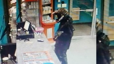 Police Release Terrifying Photo Of Axe-Wielding Robber In Tinted Helmet