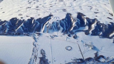 Girl Drops Into Net After Dangling By Helmet From Ski Hill's Chair Lift