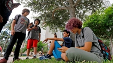 The Latest: Man Plays 'Pokemon,' Crashes Car Into Tree