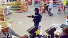 CCTV VIDEO: Robber Pulls Out Gun; Man In Cowboy Hat Tackles Him To The Ground