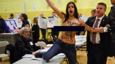 Montreal Femen Activist Arrested At Polling Station In New York City After Staging A Topless Protest