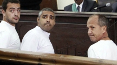A look at the trial of 3 Al-Jazeera English journalists imprisoned in Egypt over a year