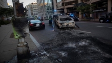 As Americans protest police behaviour, hardline anti-riot tactics draw fire