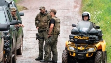 Search continues for father of girls found dead