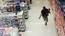 VIDEO: Daredevil Brazilian Cop Shoots Two Robbers Dead While Holding Son In His Arms