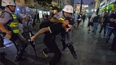 Brazil police charged with assaulting World Cup protesters
