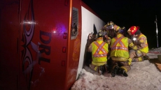 Bus carrying children flips on slick highway in central Newfoundland