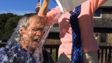 Bush takes ice bucket challenge, nominates Clinton