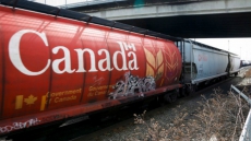 Rail cars carrying concrete ingredient and grains derail west of Banff