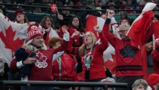Canadian hockey fans taking in Olympic double bill as women rally, men debut