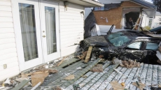 Car Hits Lightpost, Destroys Fence, Then Slams Into Home In Central Alberta