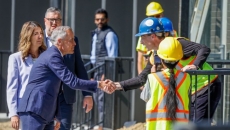 Carney comes to Alberta, talks housing, rides a sprayer, hears from separatists