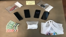 Partial brick of suspected cocaine seized by Surrey Gang Enforcement Team