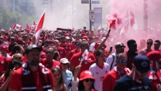 Despite being banned in stadiums, colourful smoke bombs ignite soccer fan culture
