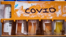 What constitutes a COVID-19 outbreak?