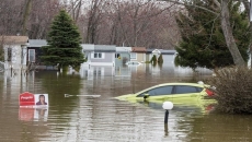 Lawsuit against makers of burst Montreal-area dike