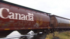 Freight Train Plunges Into River After Derailing On Quebec's North Shore