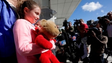 Girl Gets Back Special Teddy Bear Lost In Airport Shooting