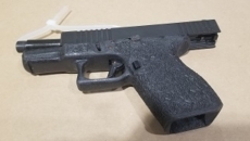 Gang enforcement team arrest man with loaded firearm and jerrycan