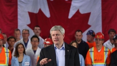 Harper's infrastructure plan to cost $300M next year, will trim surplus to $1.6B