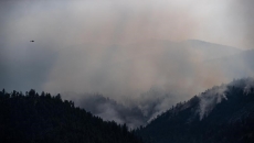 White Rock Lake fire jumps Highway 97