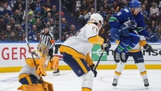Canucks win first playoff game against Predators