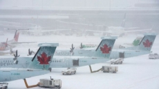 Snowstorm wreaks havoc on air travel plans, as hundreds more flights cancelled