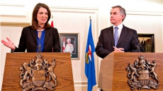Alberta Wildrose opposition shatters in mass exodus, wants premier to succeed