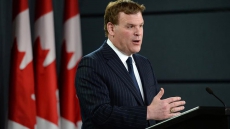 Russians face oil-sector sanctions, new travel restrictions, over Ukraine