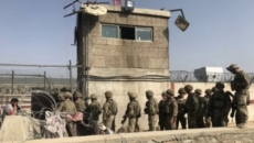 Kabul airport gates closed after deadly bombings, crowds cleared