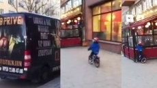 WATCH: This Little Boy Sees An Adult Club Ad On Van And Crashes His Bike Into A Shop