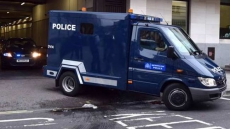 Four men charged with terror plots against police in London