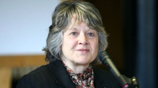 Former insurance CEO returns money from contract