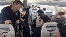 WATCH: Song Breaks Out On Flight When Attendant Sees Men Of The Deeps On Board