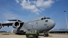 Plane carrying MH17 victims' remains arrives in Netherlands