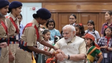 PM celebrates Raksha Bandhan with school girls